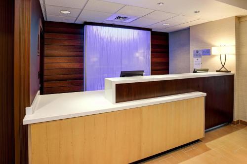 an office lobby with a reception counter with aitating at Fairfield Inn and Suites by Marriott Tampa Brandon in Tampa