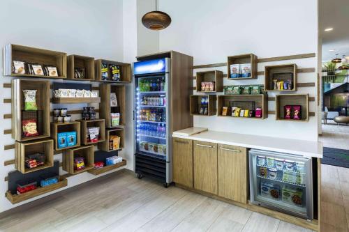 a grocery store with a refrigerator and a counter at Element Colorado Springs Downtown in Colorado Springs