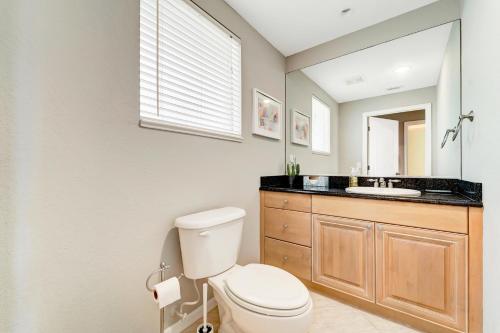 a bathroom with a toilet and a sink at Waterfront Boater's Paradise in Englewood