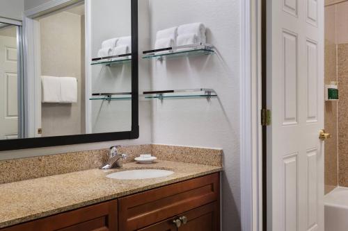 a bathroom with a sink and a mirror at Residence Inn Poughkeepsie in Poughkeepsie