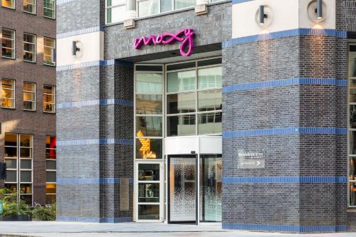 a msg sign on the side of a building at Moxy The Hague in The Hague
