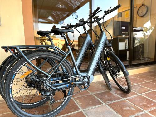 a bike is parked on a tile floor at Albir Hills Apartments in Albir
