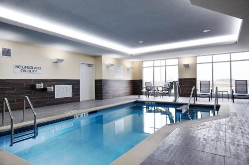 a swimming pool in a hotel lobby at Fairfield Inn & Suites Sheboygan in Sheboygan