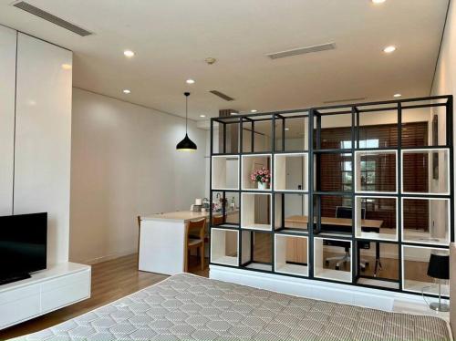 a bedroom with a large room with a bed and a desk at The Rixx Convenient Apartment @ Ben Thanh/pool/gym in Ho Chi Minh City