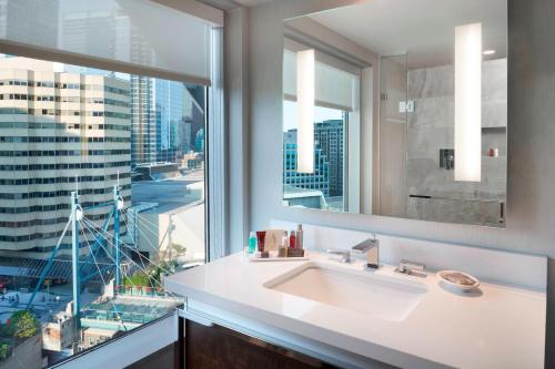 a bathroom with a sink and a large window at Toronto Marriott City Centre Hotel in Toronto