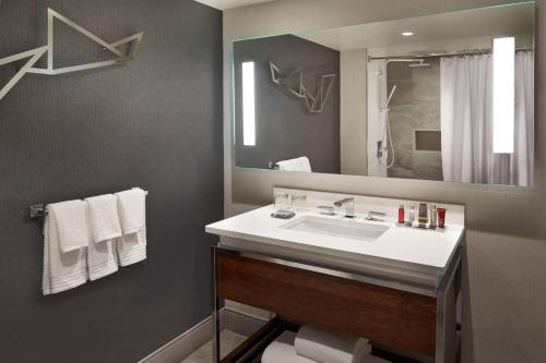 a bathroom with a sink and a mirror at Toronto Marriott City Centre Hotel in Toronto