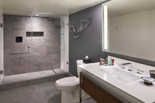 a bathroom with a toilet and a sink and a shower at Toronto Marriott City Centre Hotel in Toronto