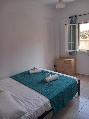 Postel nebo postele na pokoji v ubytování Saloumis House