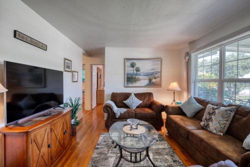 a living room with a couch and a table at Home Away from Home Daytona 3 Bedroom in South Daytona