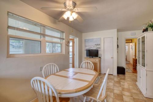 a dining room with a table and chairs and a ceiling fan at Home Away from Home Daytona 3 Bedroom in South Daytona