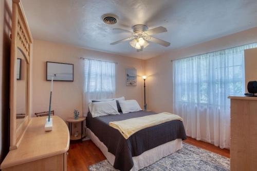 a bedroom with a bed and a ceiling fan at Home Away from Home Daytona 3 Bedroom in South Daytona