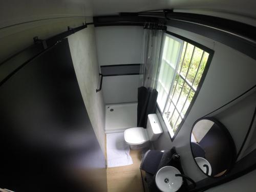an overhead view of a living room with a window at Tiny House Urban in Balneário Camboriú