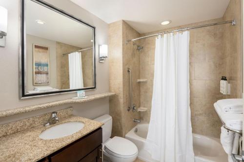 a bathroom with a sink and a toilet and a shower at TownePlace Suites by Marriott Abilene Northeast in Abilene