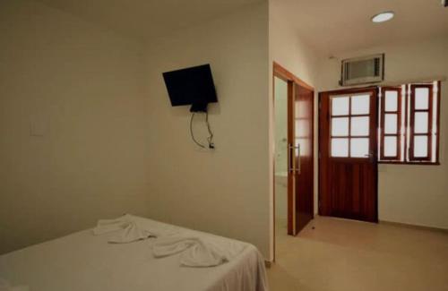 Llit o llits en una habitació de Pousada do Itaguá