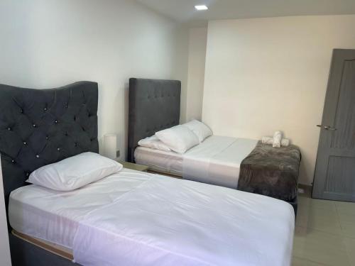 Lova arba lovos apgyvendinimo įstaigoje Hotel El Peniel