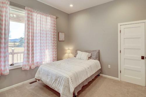 a bedroom with a bed and a window at Spacious Farmhouse Near Hikes and Waterfalls in Harrison