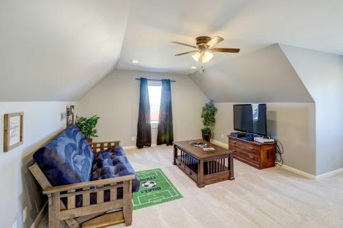 a living room with a couch and a tv at Spacious Farmhouse Near Hikes and Waterfalls in Harrison