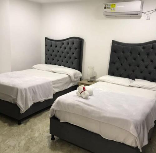 Кровать или кровати в номере Hotel El Peniel