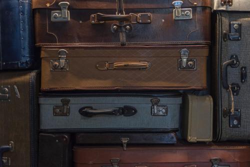 a pile of suitcases stacked on top of each other at Kimon Hotel Athens in Athens