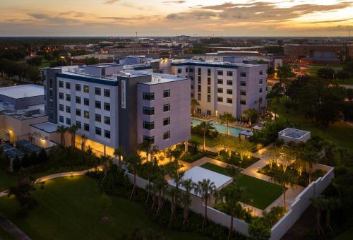an aerial view of a building in a city at night at The Celeste Hotel, Orlando, a Tribute Portfolio Hotel in Orlando
