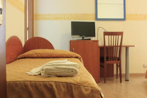 Postel nebo postele na pokoji v ubytování Hotel Bellevue