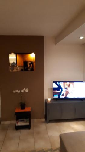 TV a/nebo společenská místnost v ubytování Shamrock Oostduinkerke