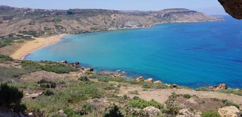 an aerial view of a beach and the ocean at Villa Serenity B&B in Sannat