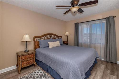 a bedroom with a bed and a ceiling fan at Unit 3306 - Ocean & Racquet Resort in Saint Augustine Beach
