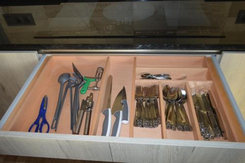 a drawer filled with lots of utensils at Mas Piua in Girona