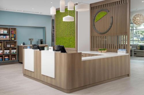 a lobby with a reception desk in a store at Element Jacksonville Beach in Jacksonville Beach