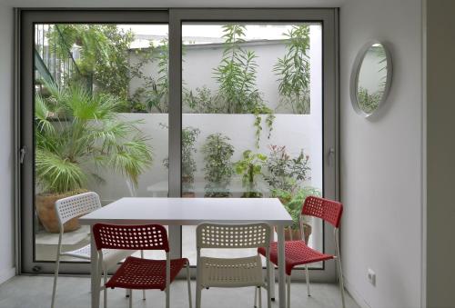 a dining room with a table and chairs at Art Gallery Apartment in Lisbon
