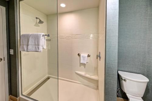 a bathroom with a shower and a toilet at Residence Inn by Marriott Kansas City Downtown/Convention Center in Kansas City
