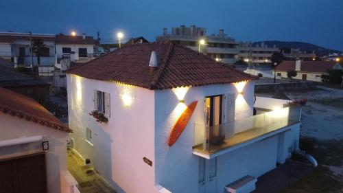 a white building with lights on top of it at Casa de Chanquete in Viana do Castelo