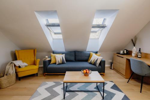 a living room with a couch and a table at Stacja Szklarska Poręba - cisza i komfort in Szklarska Poręba