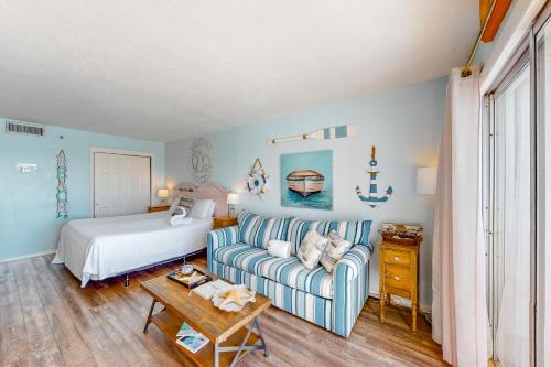 a living room with a couch and a bed at Islander W 603 in Fort Walton Beach