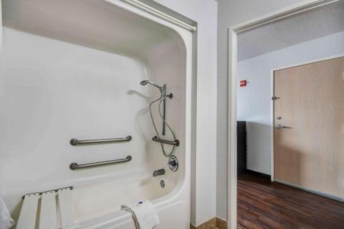 a bathroom with a shower and a mirror at Motel 6-San Antonio, TX - Sea World North in San Antonio