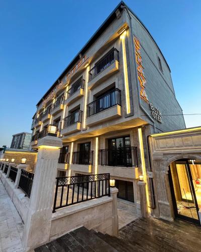 a large building with lights on the side of it at Özkaya hotel in Sivas