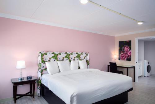 Un ou plusieurs lits dans un hébergement de l'établissement Bella Vista Hotel & Suites