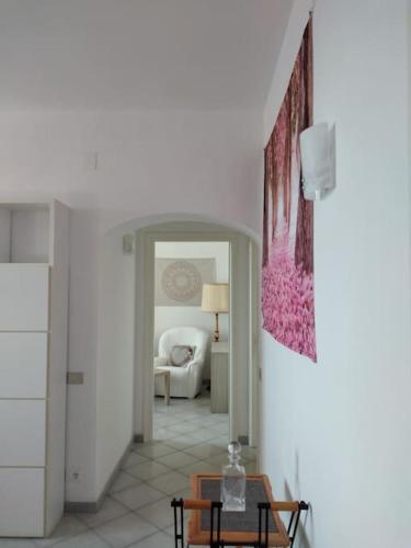 a hallway with a living room with a couch and a table at CasarinoLaurino Among Cinque Terre Genova And Portofino in Uscio