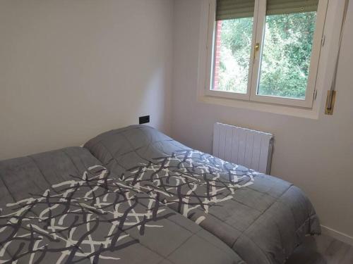 Llit o llits en una habitació de Precioso apartamento en Bilbao.