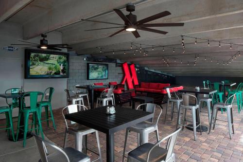 a restaurant with tables and chairs and a ceiling fan at Las Vegas Marriott in Las Vegas