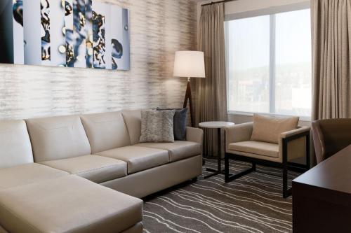 a living room with a couch and a chair at Residence Inn by Marriott Anaheim Brea in Brea