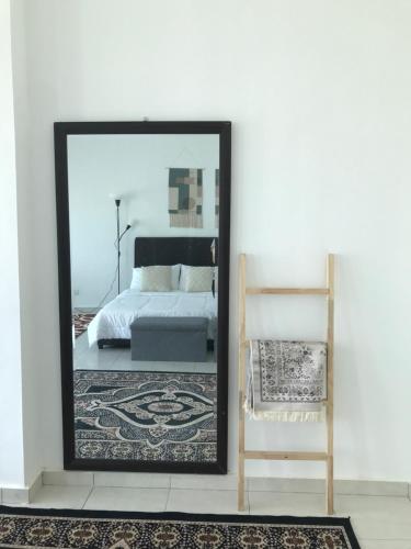 Ένα ή περισσότερα κρεβάτια σε δωμάτιο στο Homestay Krubong@Melaka