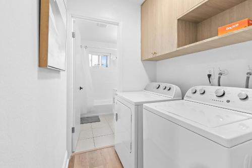 a white laundry room with a washer and dryer at @ Marbella Lane - Fresh and Vibrant 3BR Home in San Jose