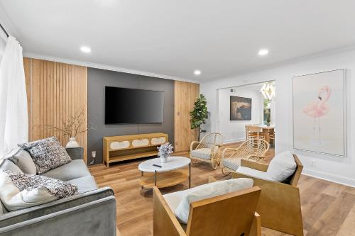 a living room with two couches and a television at #Marbella Lane - Modern 3BR Oasis in SiliconValley in San Jose