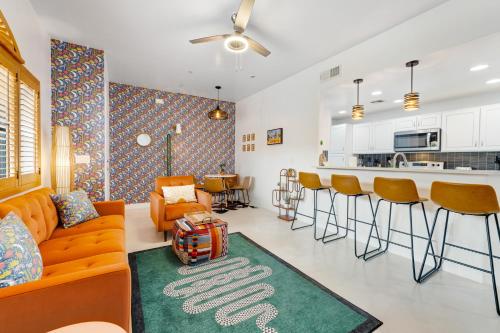 a living room with a couch and a bar at Sonoran Suite at St Phillips in Tucson