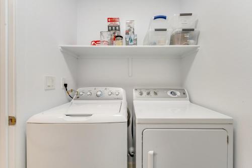 a kitchen with two white appliances and a shelf at Sonoran Suite at St Phillips in Tucson