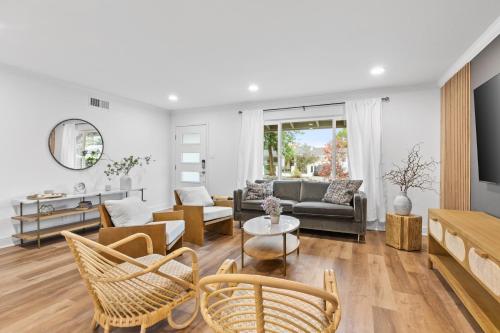 a living room with a couch and a table at #Marbella Lane - Modern 3BR Oasis in SiliconValley in San Jose