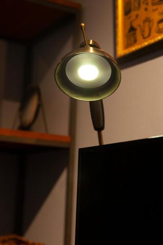a small lamp sitting on top of a wall at Code Rooms Imaizumi in Fukuoka