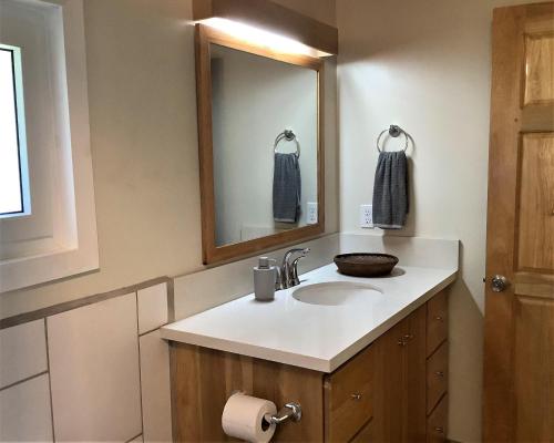 a bathroom with a sink and a mirror at Stargazer in West End